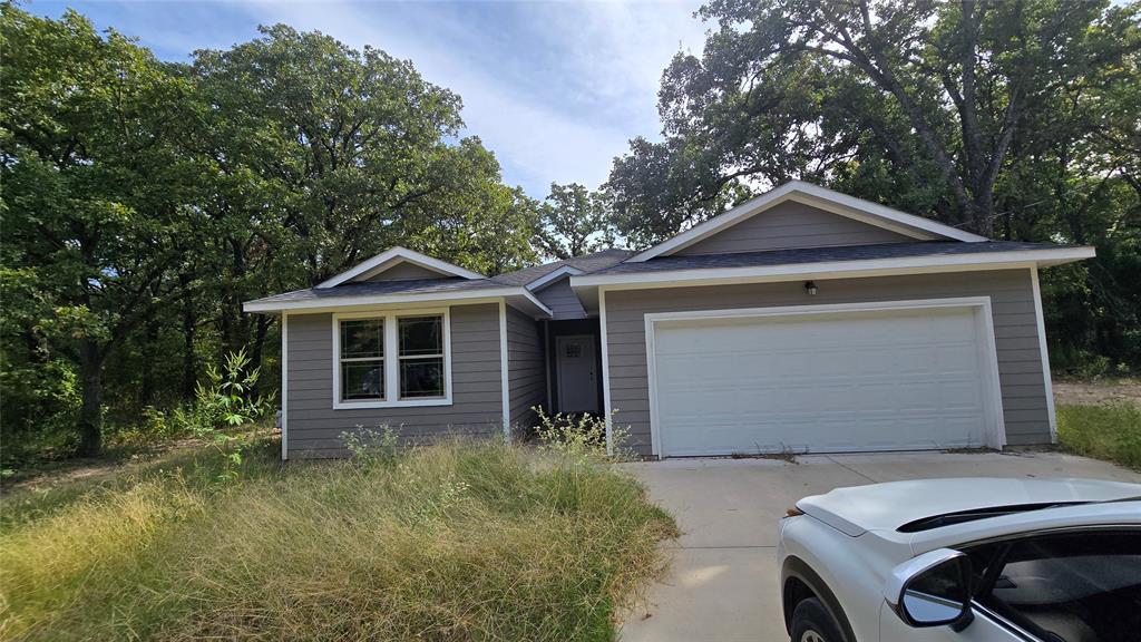 228 East Acres Road Gun Barrel City, TX 75156 - Photo 24 of 25 a front view of a house with garden