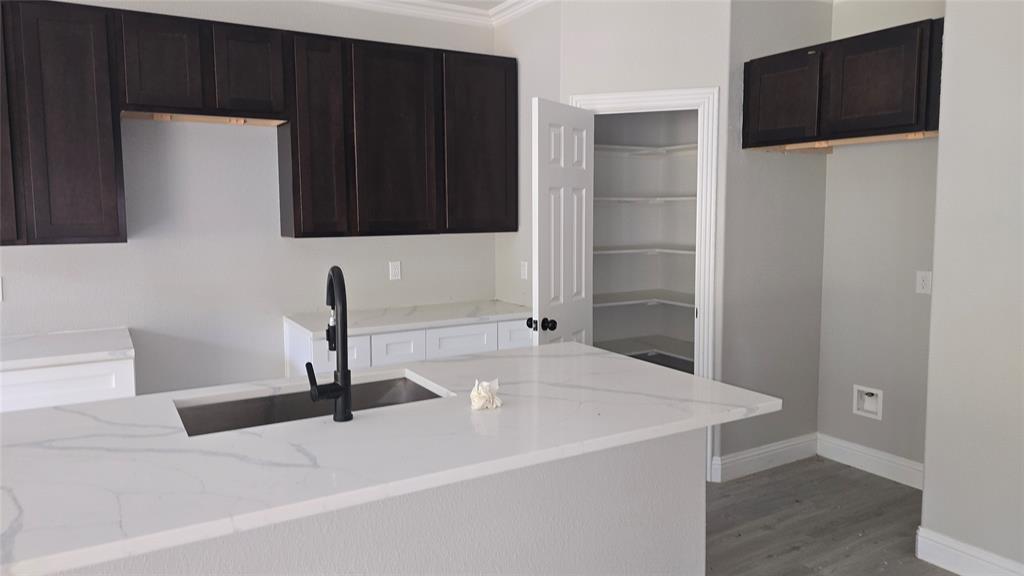 228 East Acres Road Gun Barrel City, TX 75156 - Photo 3 of 25 a kitchen with a sink and a refrigerator