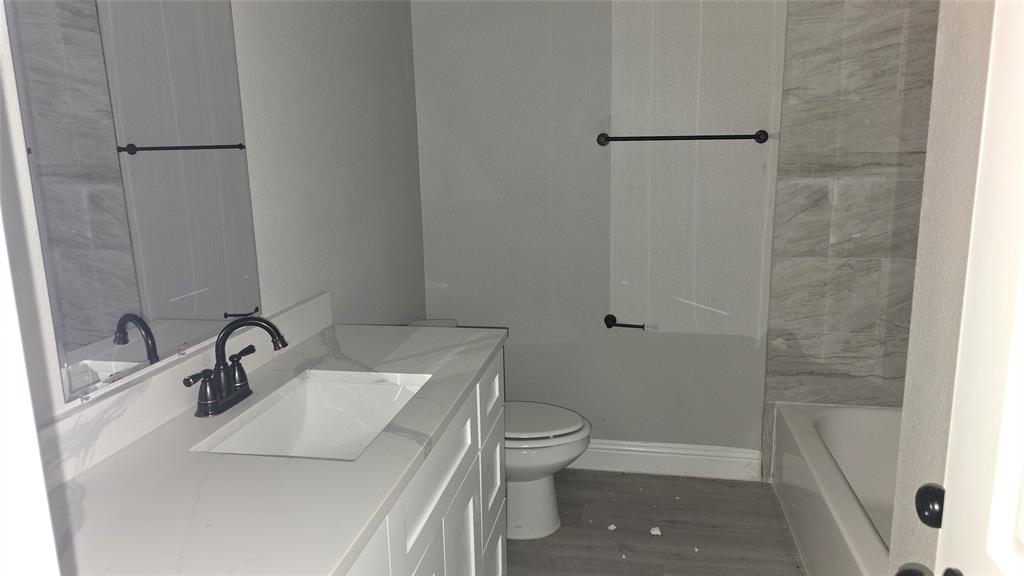 228 East Acres Road Gun Barrel City, TX 75156 - Photo 7 of 25 a bathroom with a sink toilet and shower