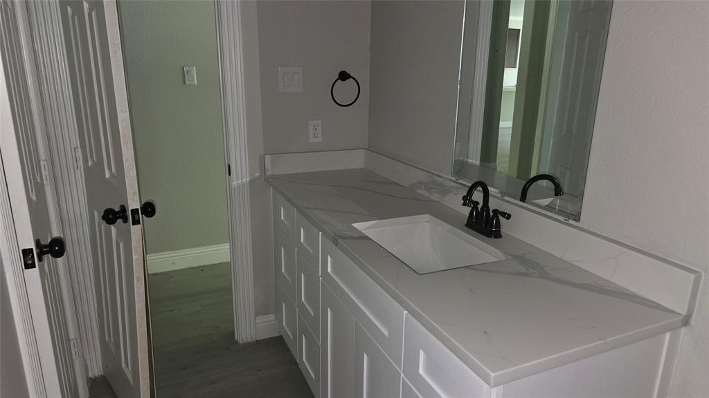 228 East Acres Road Gun Barrel City, TX 75156 - Photo 9 of 25 a bathroom with a sink and mirror