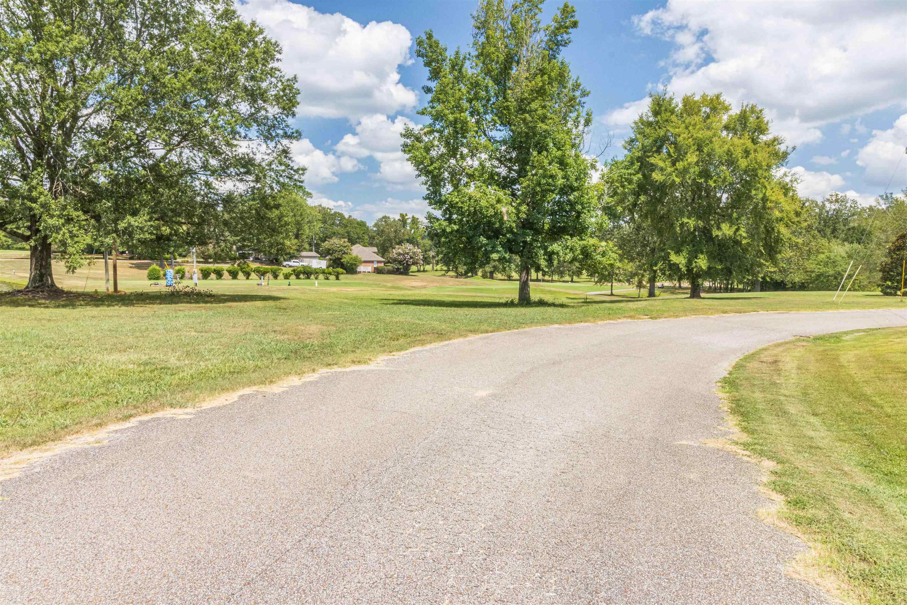 0 Grandview Circle Adamsville, TN 38310 - Photo 8 of 8 a view of a swimming pool and a yard