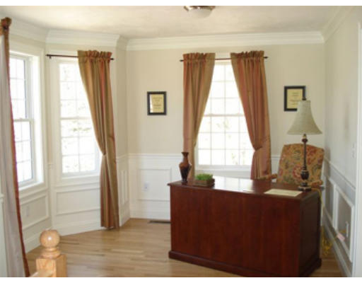 126 Smith Street, Unit 1 Lowell, MA 01851 - Photo 19 of 19 a living room with a large window couches and kitchen view