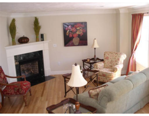 126 Smith Street, Unit 1 Lowell, MA 01851 - Photo 9 of 19 a living room with furniture and a fireplace