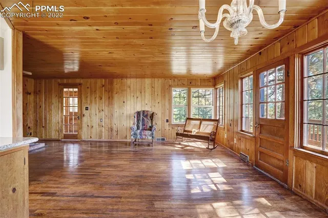 a kitchen with cabinets appliances and a window