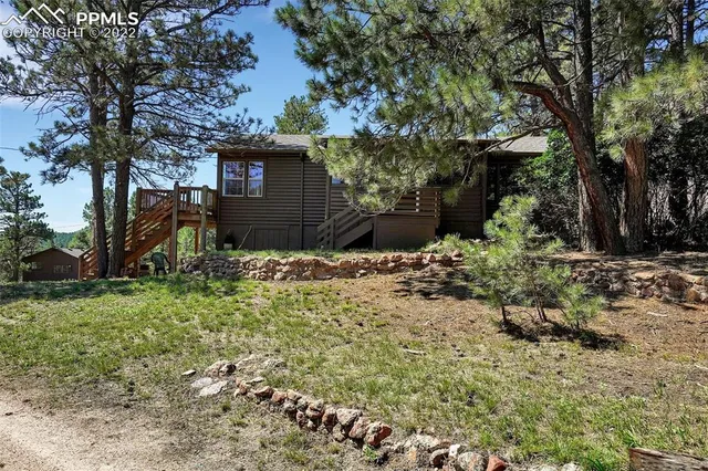 a backyard of a house with lots of green space