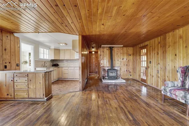 a open kitchen with white cabinets and stainless steel appliances