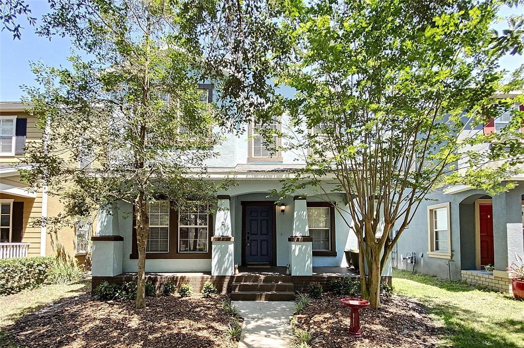 5948 Beaconpark Street Lithia, FL 33547 - Photo 1 of 1 a front view of a house with a tree