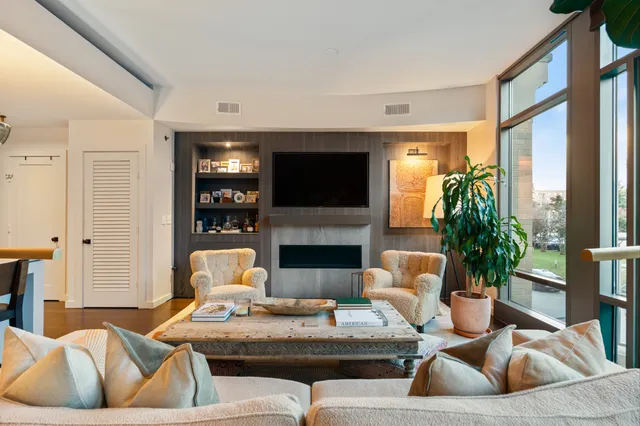 a kitchen with stainless steel appliances granite countertop a refrigerator and a stove