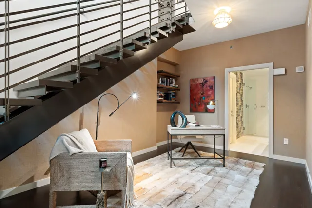 a bathroom with a granite countertop sink a mirror and shower