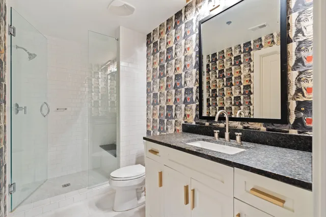 a bedroom with a bed and a table in it