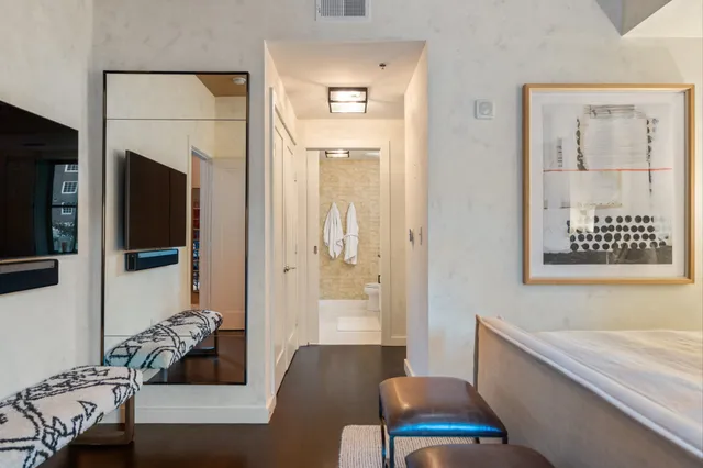 a spacious bathroom with a granite countertop tub sink and mirror