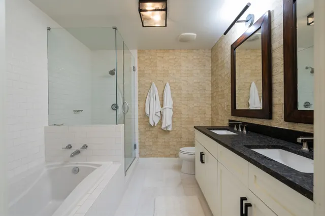 a living room with fireplace furniture and a large window