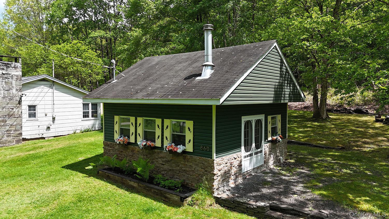 860 River Road Callicoon, NY 12723 - Photo 29 of 45 a view of a house with backyard porch and sitting area
