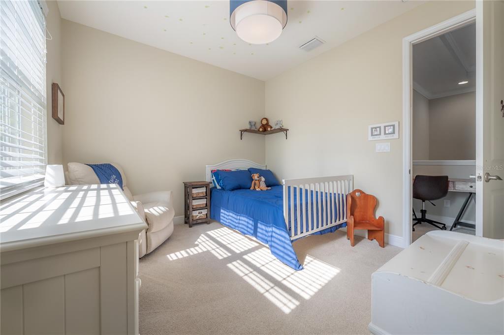3108 West Villa Rosa Street Tampa, FL 33611 - Photo 41 of 58 a bedroom with a bed and a chandelier