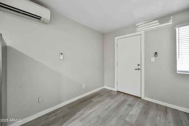 a view of a room that has wooden floor in it