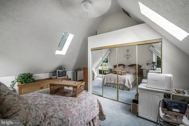 a view of a chair and tables in the balcony