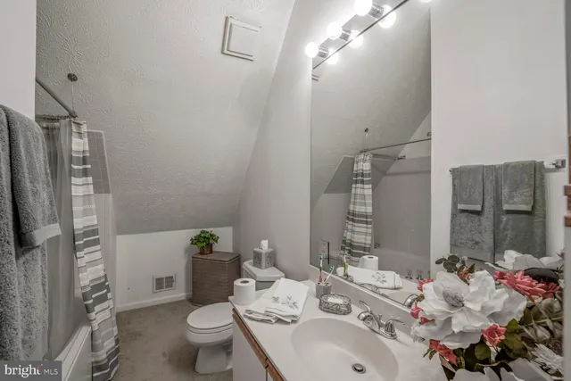 a front view of house with deck and outdoor seating