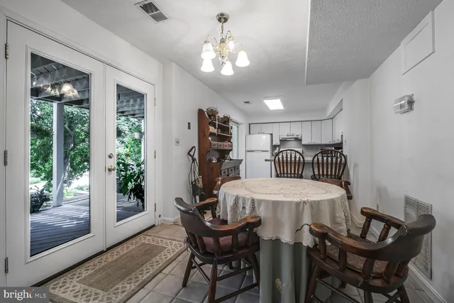 a green field with trees in the background