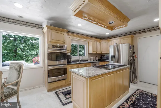 a kitchen with a refrigerator and countertop
