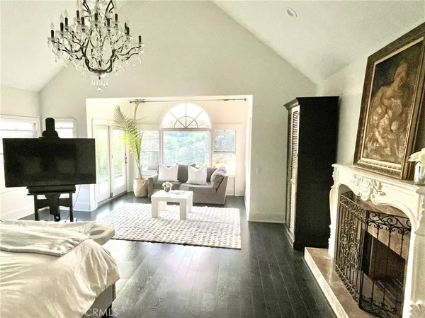 a living room with furniture fireplace and a flat screen tv