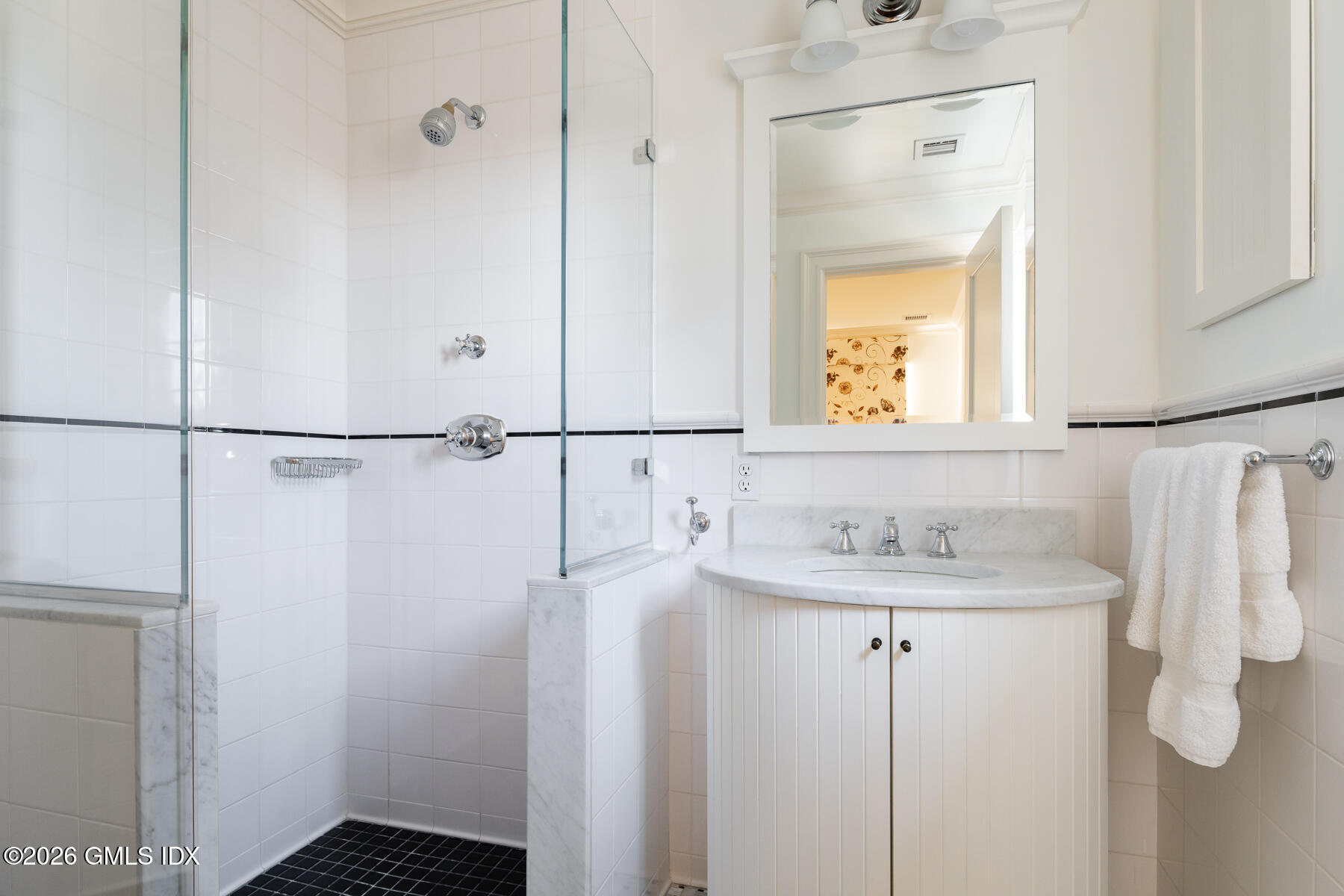 63 Wesskum Wood Road Riverside, CT 06878 - Photo 19 of 26 a bathroom with a sink and mirror