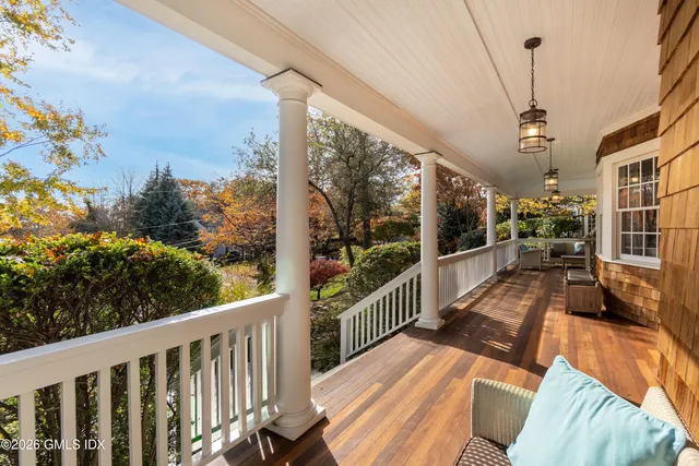 a view of a balcony with wooden floor