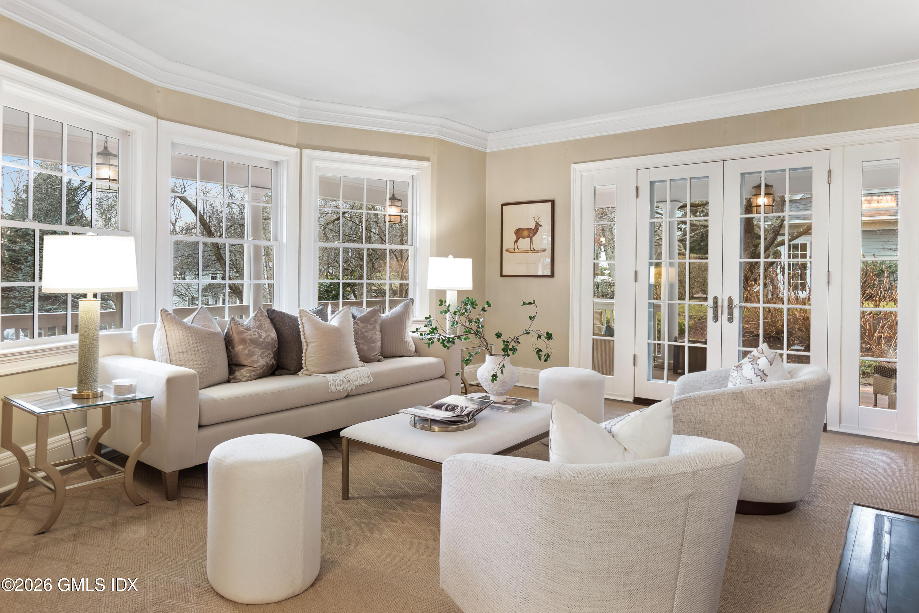 63 Wesskum Wood Road Riverside, CT 06878 - Photo 4 of 26 a living room with furniture and floor to ceiling windows