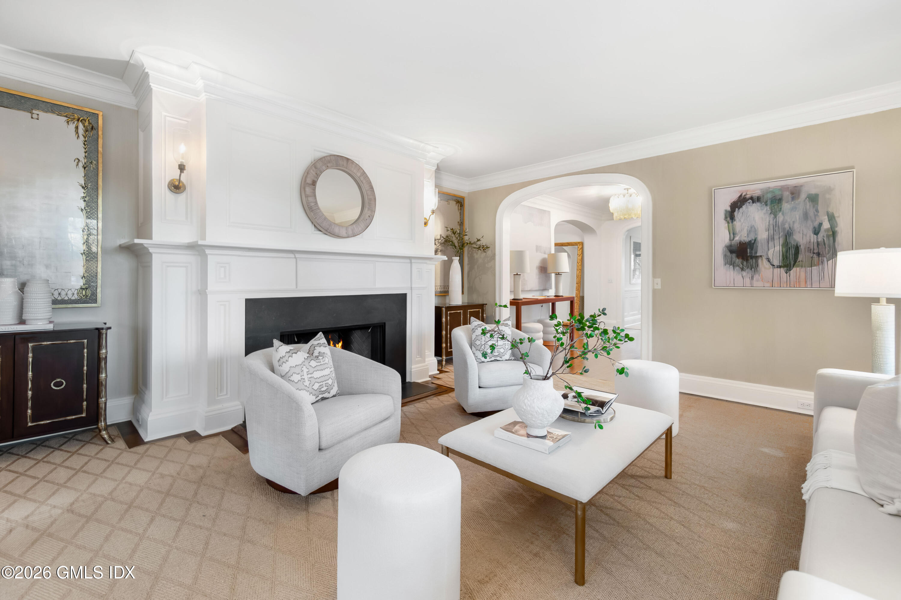 63 Wesskum Wood Road Riverside, CT 06878 - Photo 5 of 26 a living room with furniture a fireplace and a potted plant