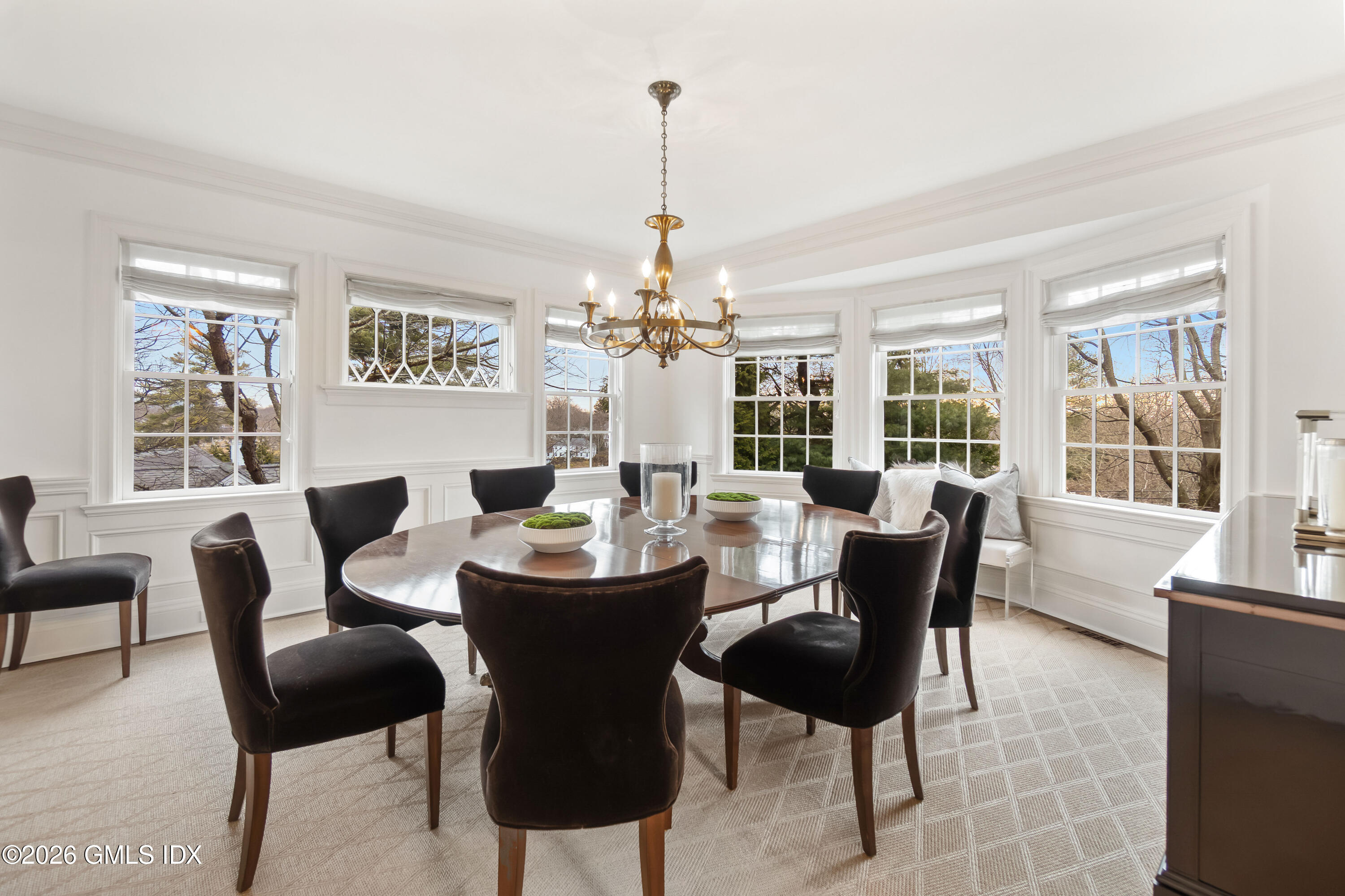 63 Wesskum Wood Road Riverside, CT 06878 - Photo 7 of 26 a dining room with furniture a chandelier and window