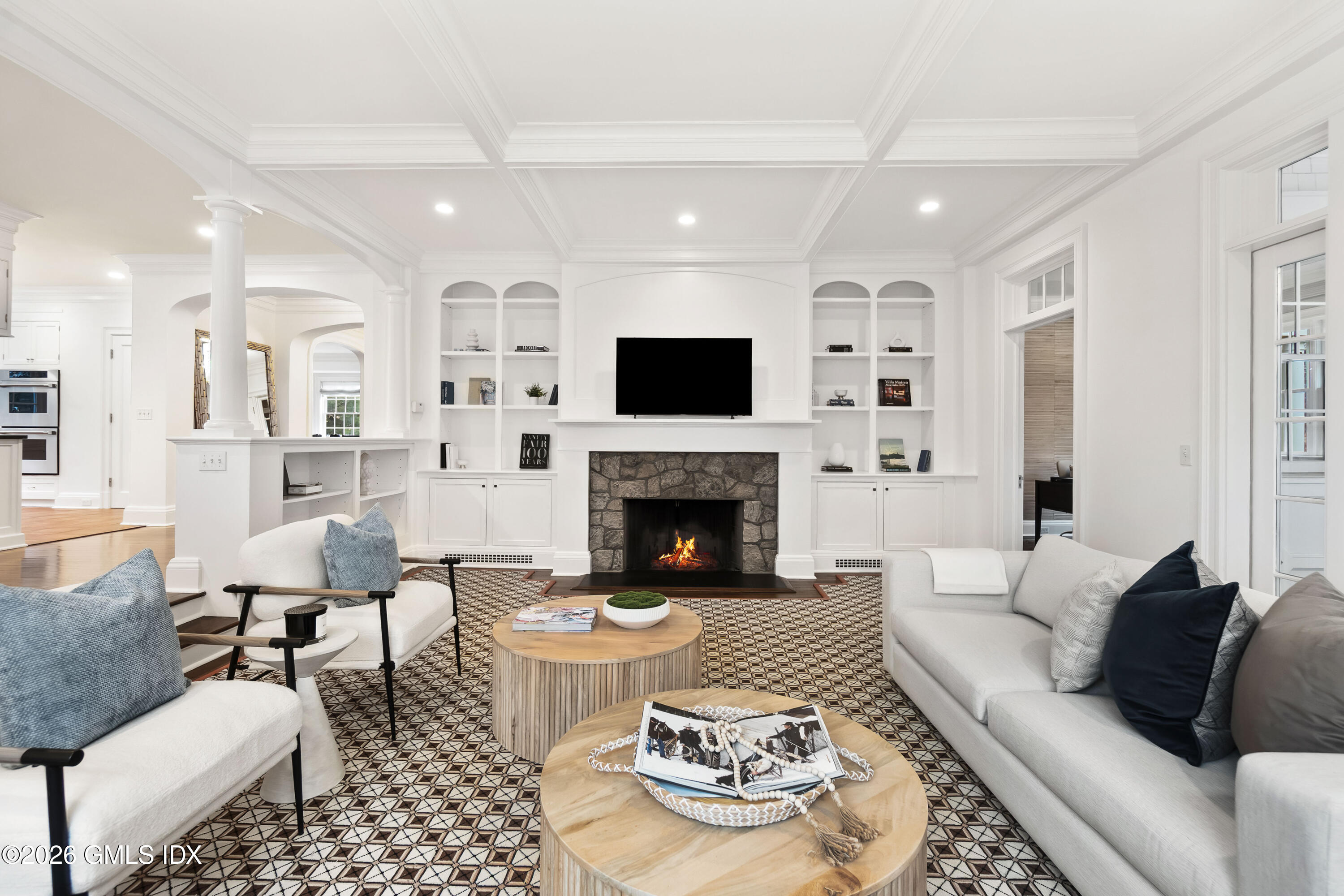 63 Wesskum Wood Road Riverside, CT 06878 - Photo 9 of 26 a living room with furniture and a fireplace