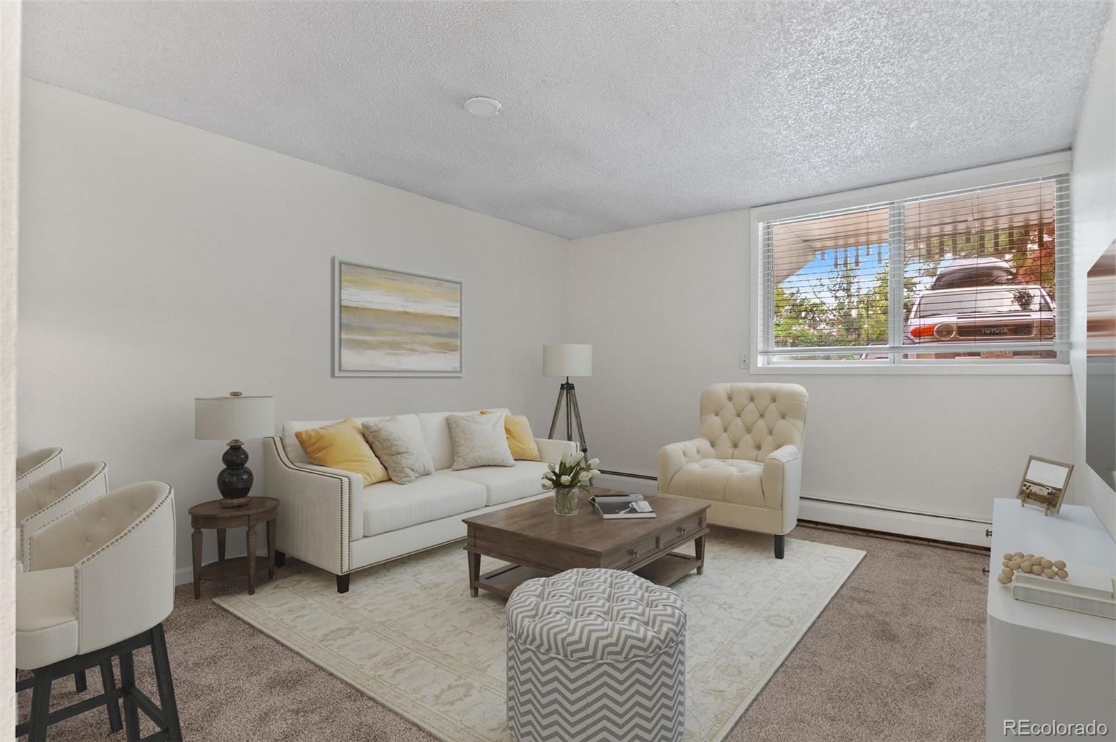2707 Valmont Road, Unit 106 Boulder, CO 80304 - Photo 11 of 38 a living room with furniture and a window