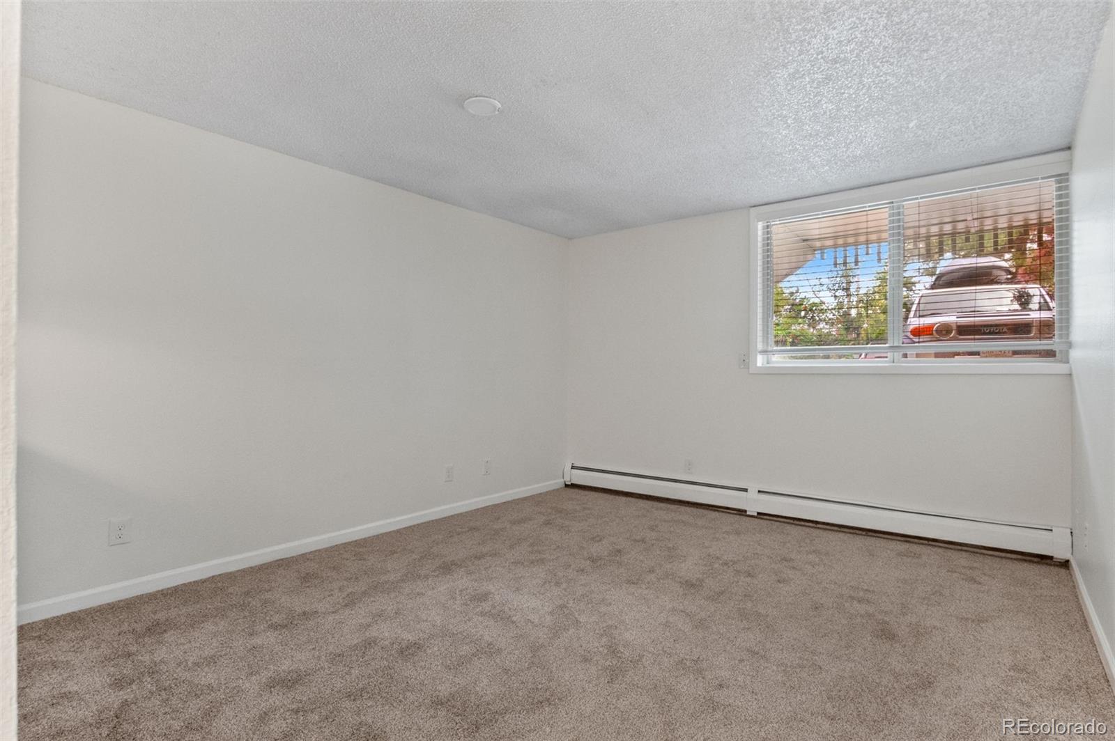 2707 Valmont Road, Unit 106 Boulder, CO 80304 - Photo 12 of 38 an empty room with windows