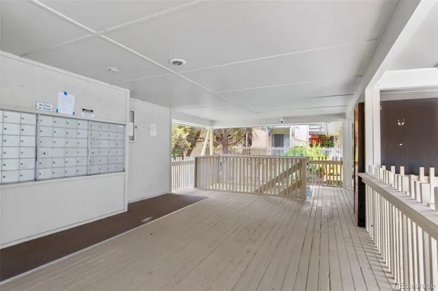 a view of a room with balcony and wooden floor