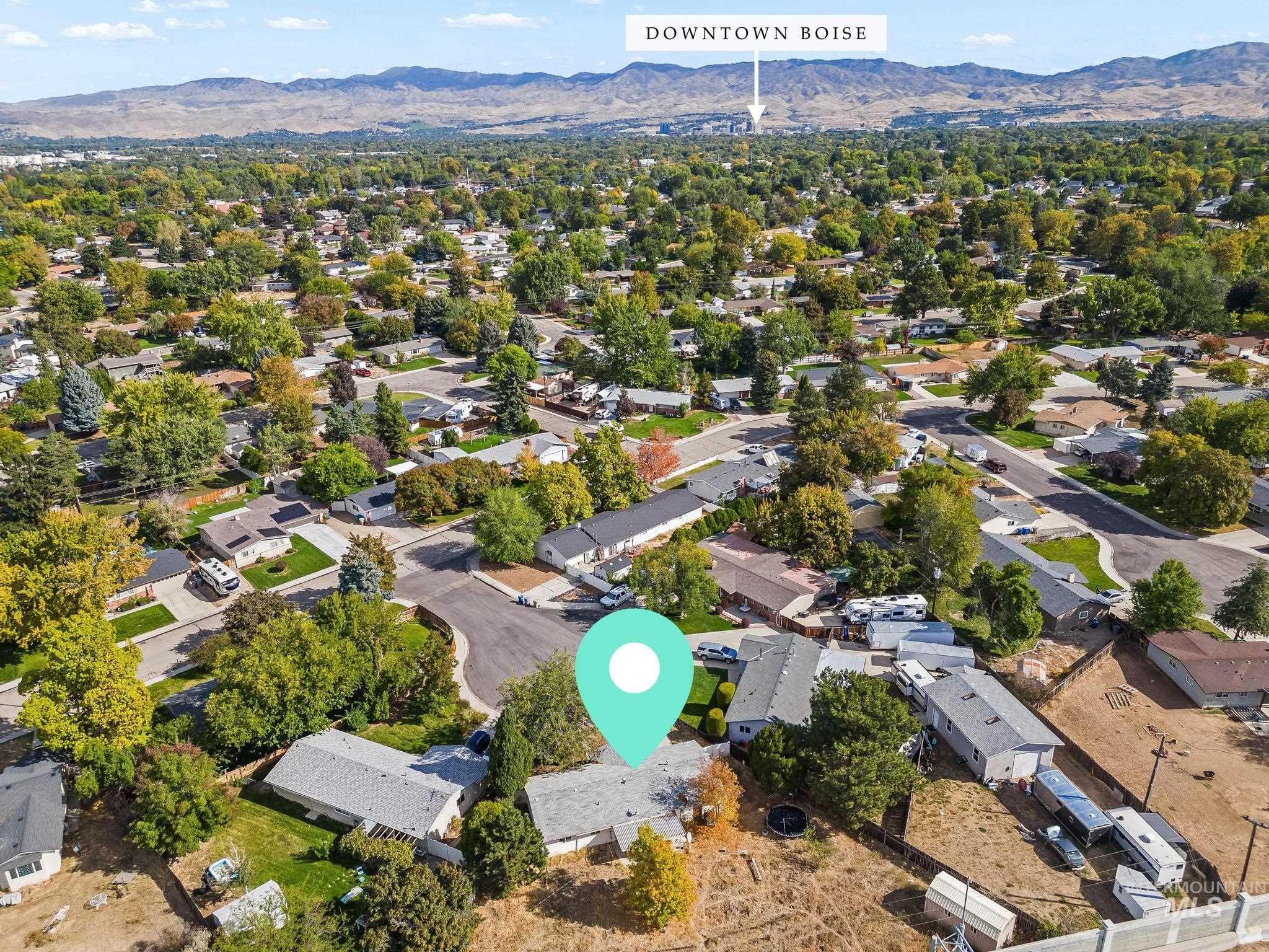6295 West Grandview Place Boise, ID 83709 - Photo 27 of 29 Aerial view of residential area with a mountain backdrop
