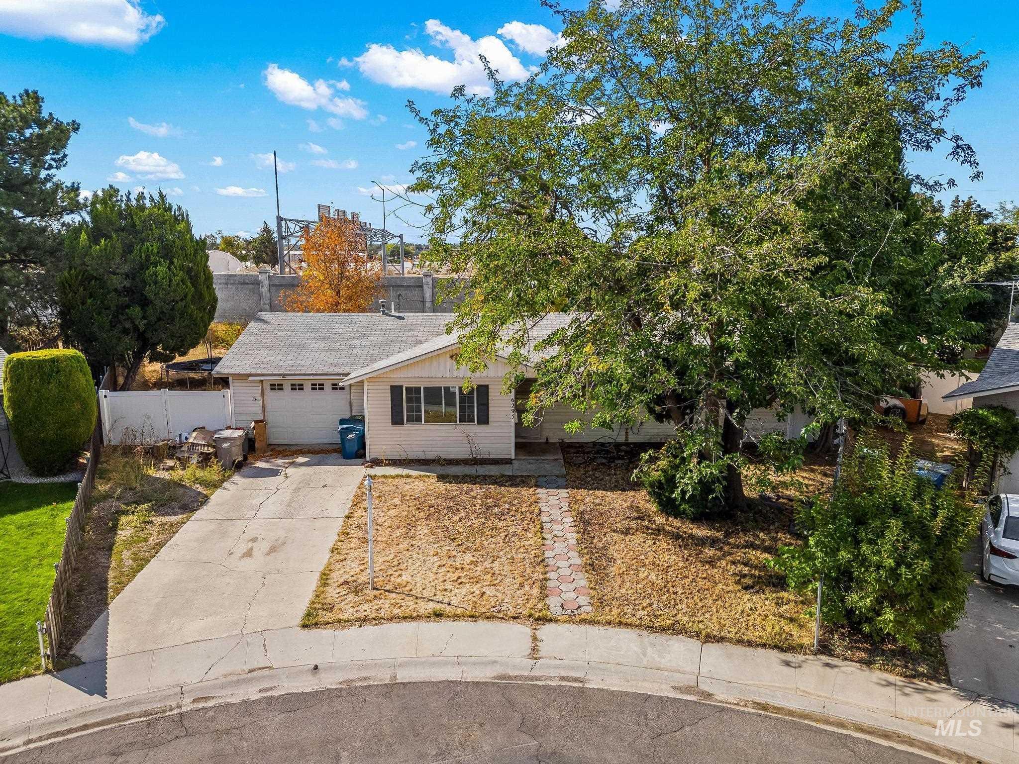6295 West Grandview Place Boise, ID 83709 - Photo 4 of 29 View of front of home with concrete driveway and an attached garage