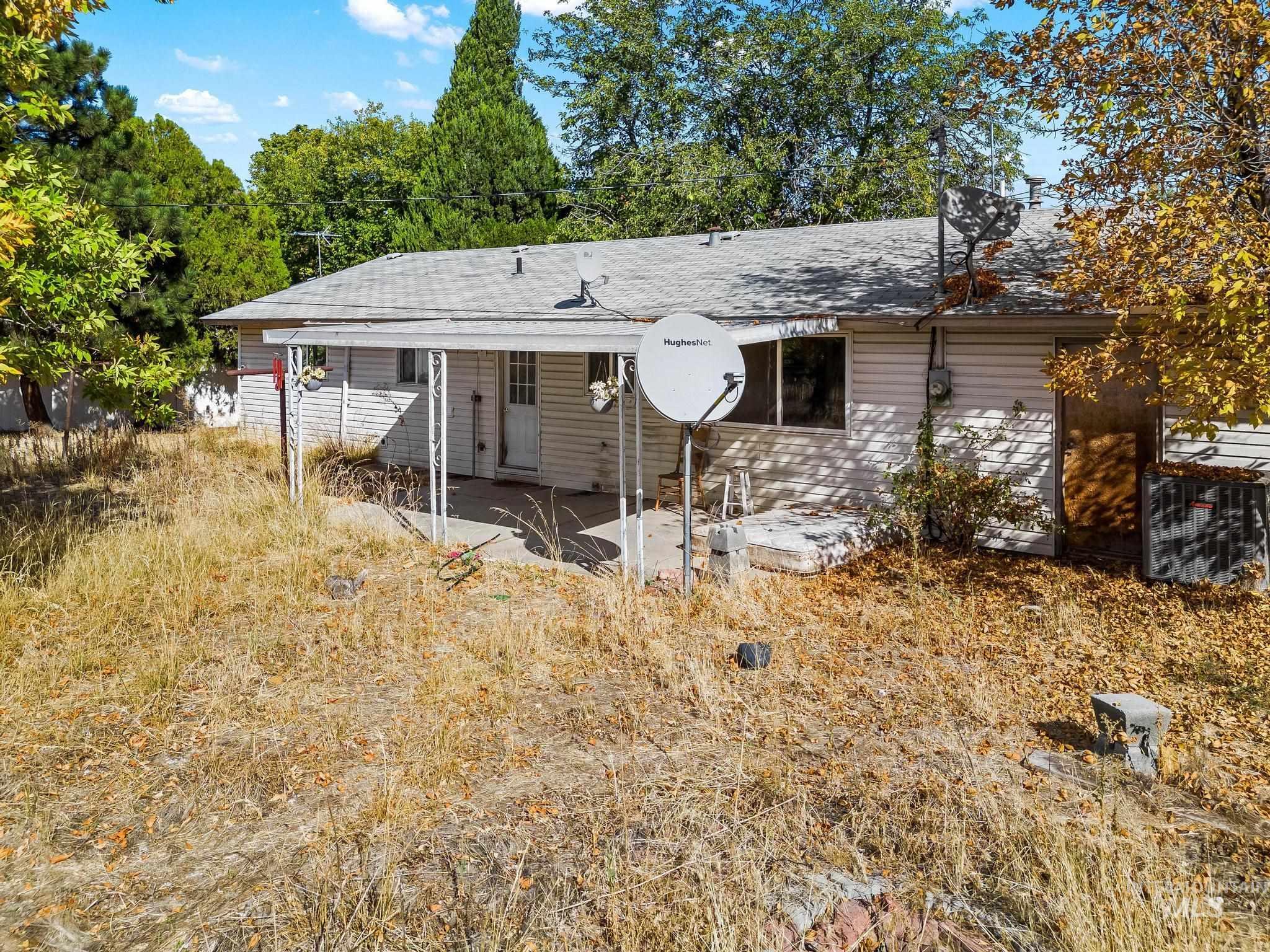 6295 West Grandview Place Boise, ID 83709 - Photo 5 of 29 Rear view of house featuring a patio area