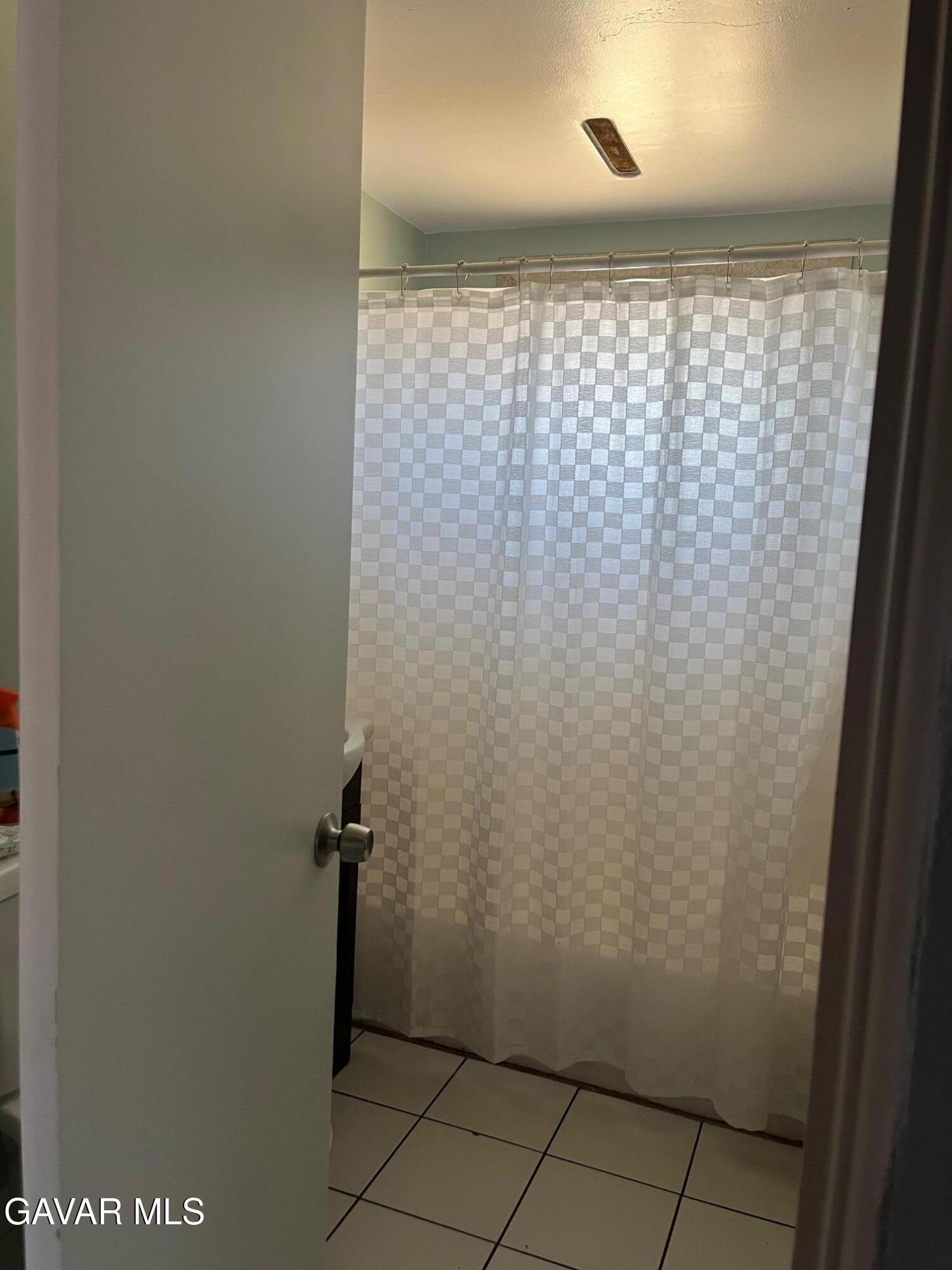 3354 Arthur Avenue Mojave, CA 93501 - Photo 12 of 12 a bathroom with a shower