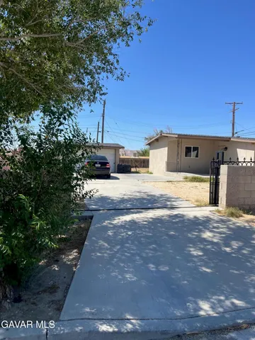 a view of a backyard of the house
