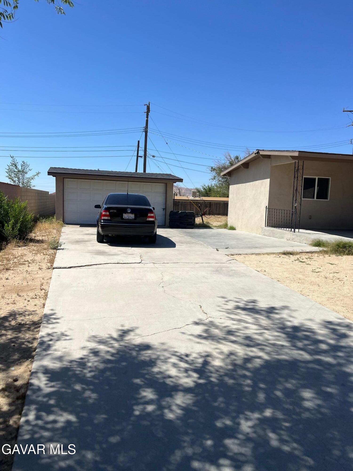 3354 Arthur Avenue Mojave, CA 93501 - Photo 4 of 12 a front view of a house with a yard