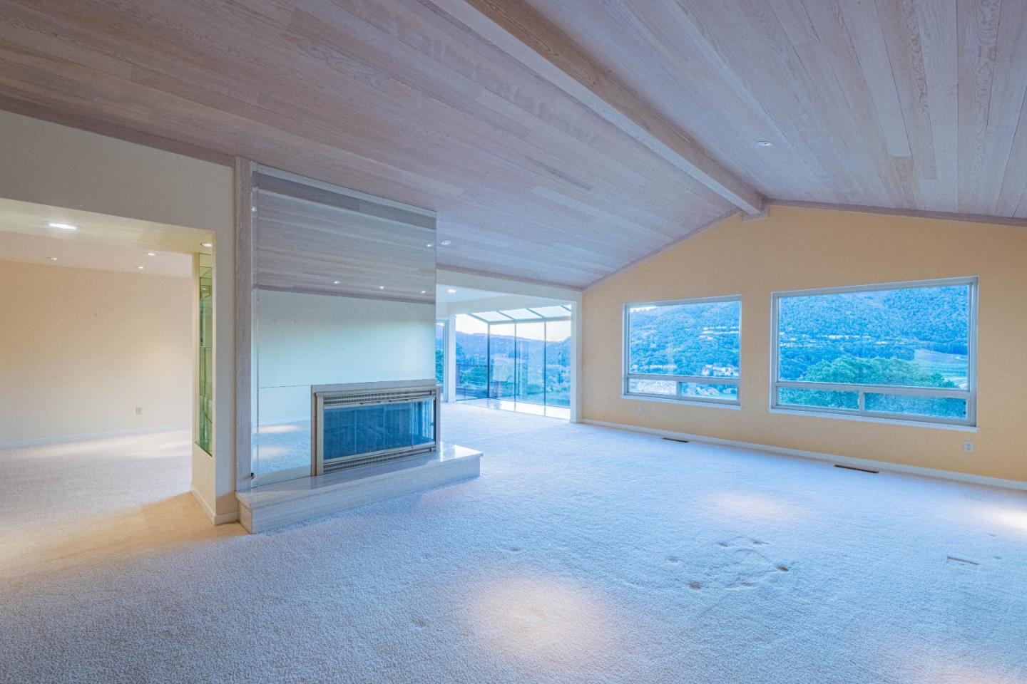 10000 Eddy Road Carmel, CA 93923 - Photo 13 of 37 an empty room with furniture and fireplace