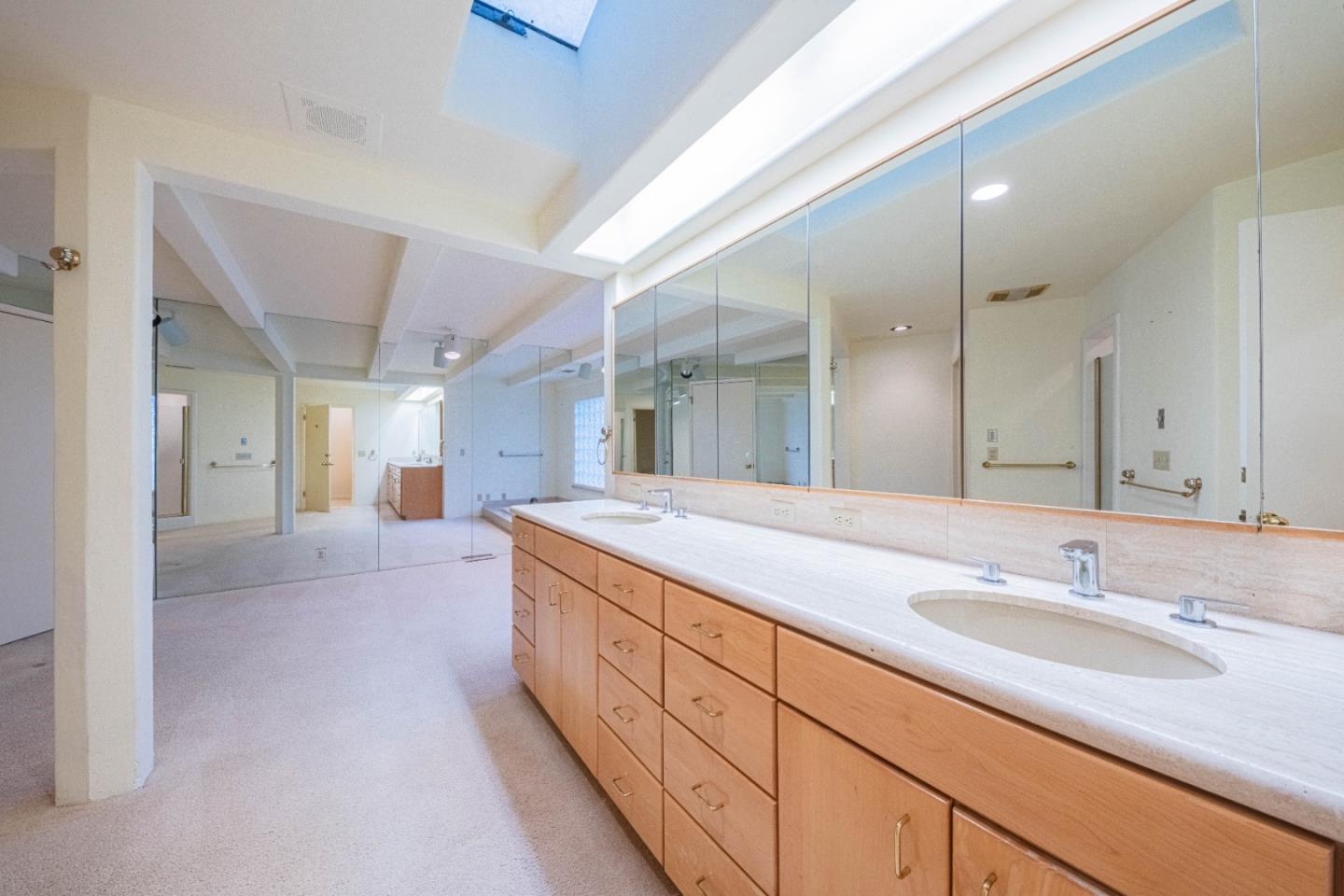 10000 Eddy Road Carmel, CA 93923 - Photo 25 of 37 a spacious bathroom with a granite countertop sink a mirror and a