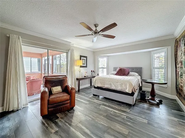 a bedroom with a bed and a couch