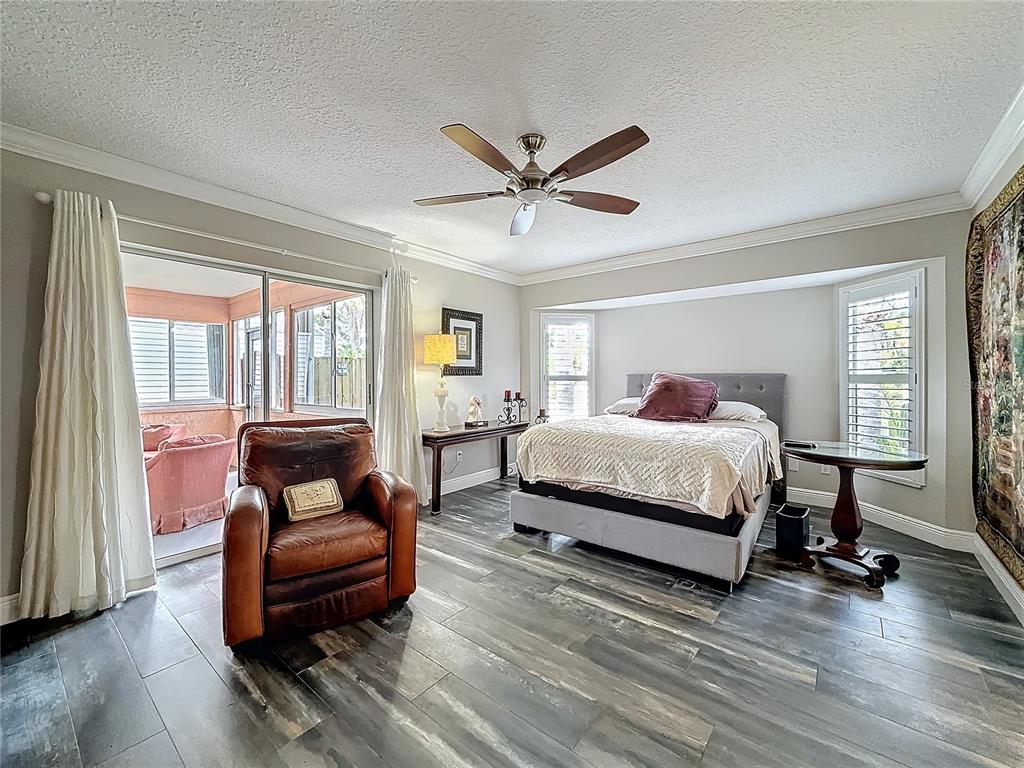 2686 Southwest Fairgreen Road Port St. Lucie, FL 34987 - Photo 13 of 36 a bedroom with a bed and a couch