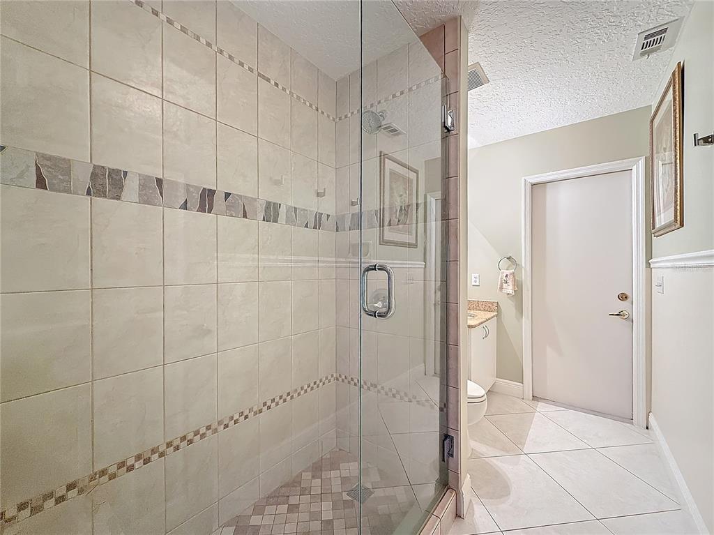 2686 Southwest Fairgreen Road Port St. Lucie, FL 34987 - Photo 22 of 36 a bathroom with a shower