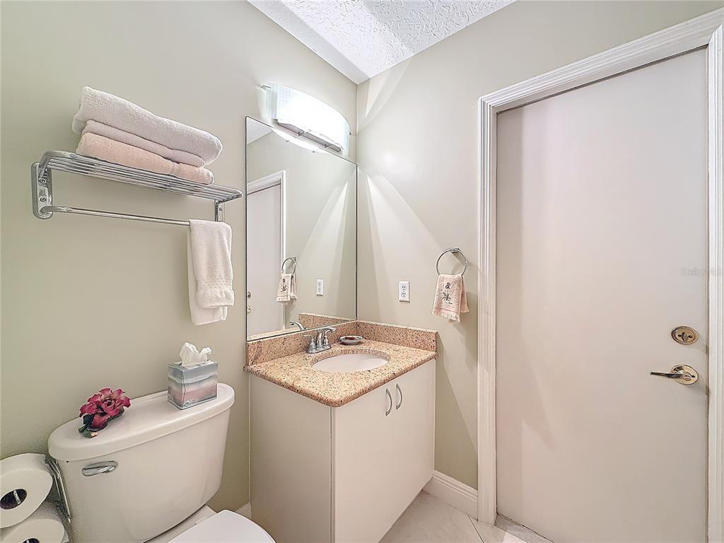 2686 Southwest Fairgreen Road Port St. Lucie, FL 34987 - Photo 23 of 36 a bathroom with a sink toilet and shower