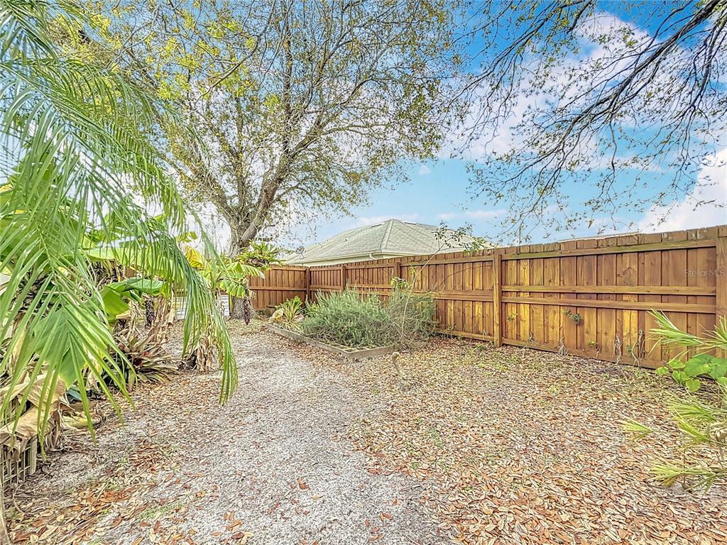 2686 Southwest Fairgreen Road Port St. Lucie, FL 34987 - Photo 31 of 36 a view of a backyard