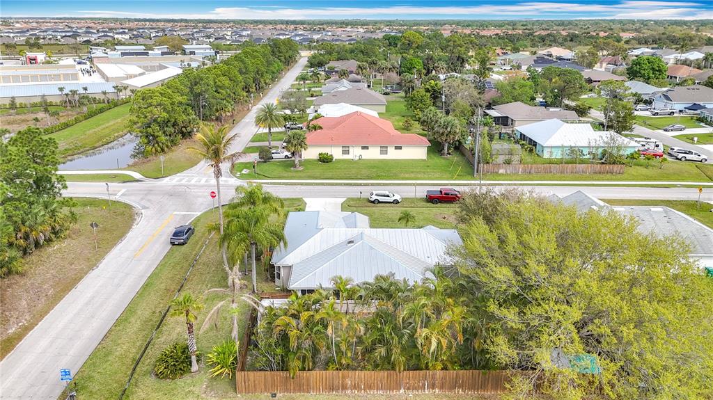 2686 Southwest Fairgreen Road Port St. Lucie, FL 34987 - Photo 33 of 36 an aerial view of residential houses with outdoor space and swimming pool