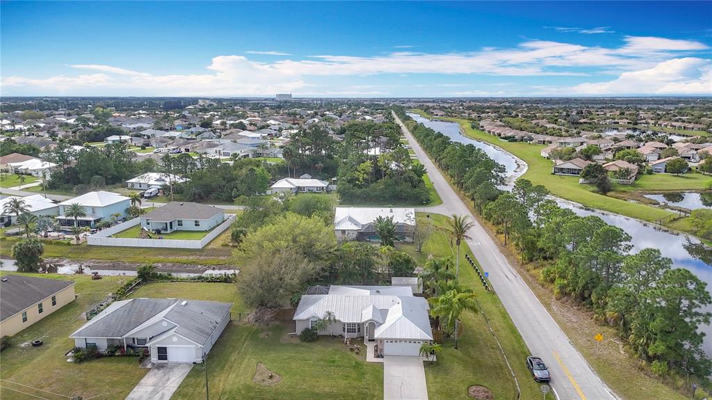 2686 Southwest Fairgreen Road Port St. Lucie, FL 34987 - Photo 36 of 36 an aerial view of residential houses with outdoor space