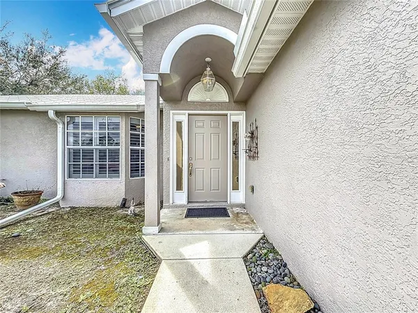 a front view of a house with a rug