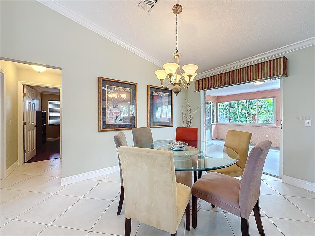 2686 Southwest Fairgreen Road Port St. Lucie, FL 34987 - Photo 9 of 36 a view of a dining room with furniture window and outside view